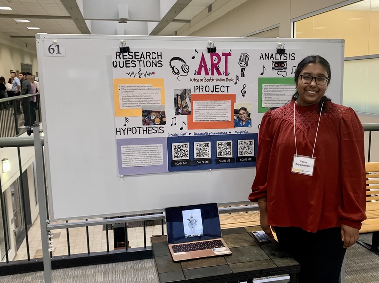 Veena Kappaganthu with her poster